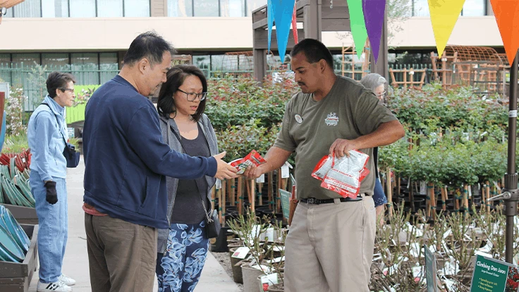 The free rose giveaway honored the founder of Armstrong Garden Centers, John Armstrong. 